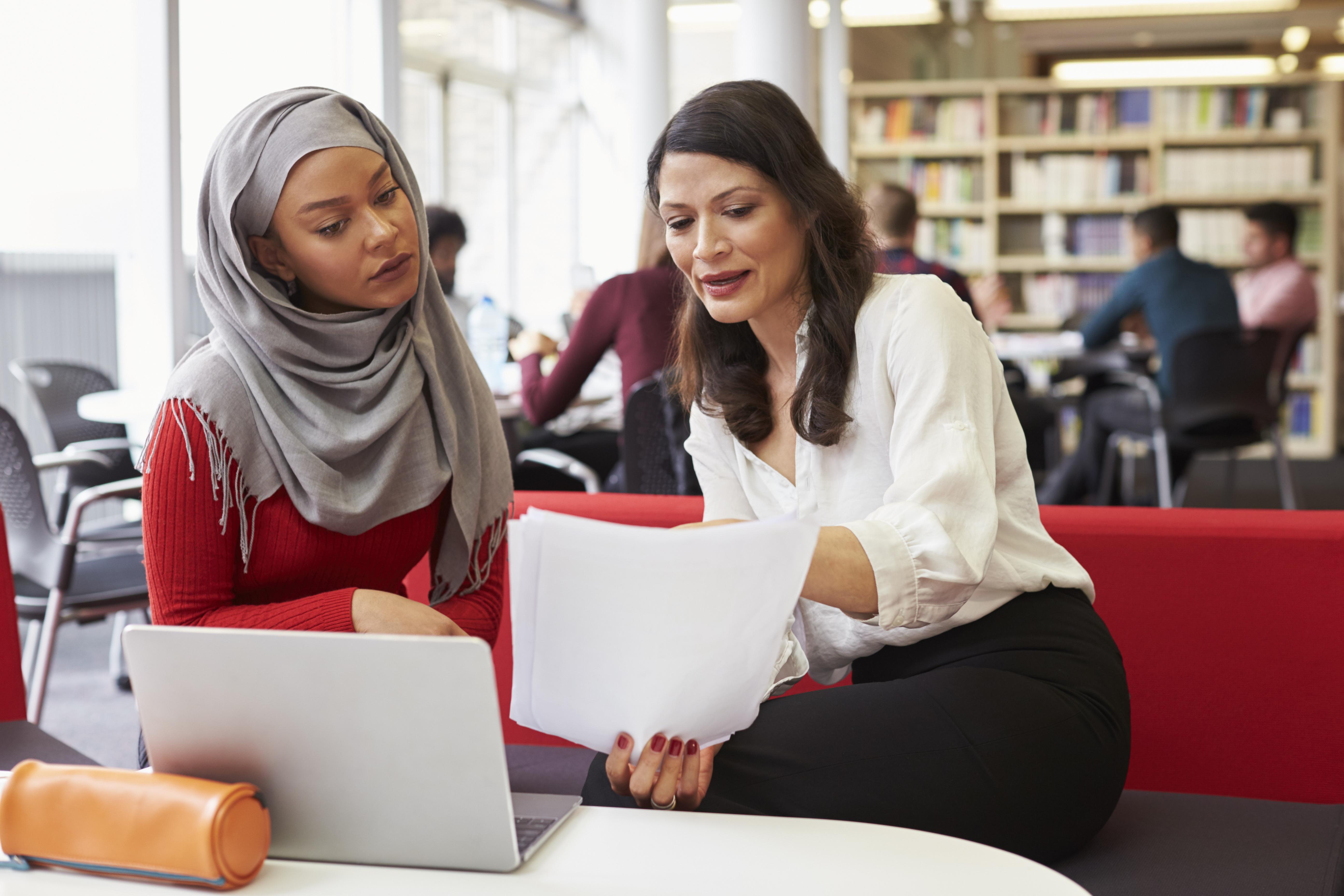 woman administrator talking to student